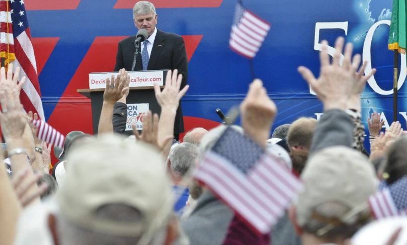 OLYMPIA -- Evangelist Franklin Graham leads a crowd of more than 4,300 in prayer at the Capitol Campus on Wednesday. (Jim Camden/The Spokesman-Review)