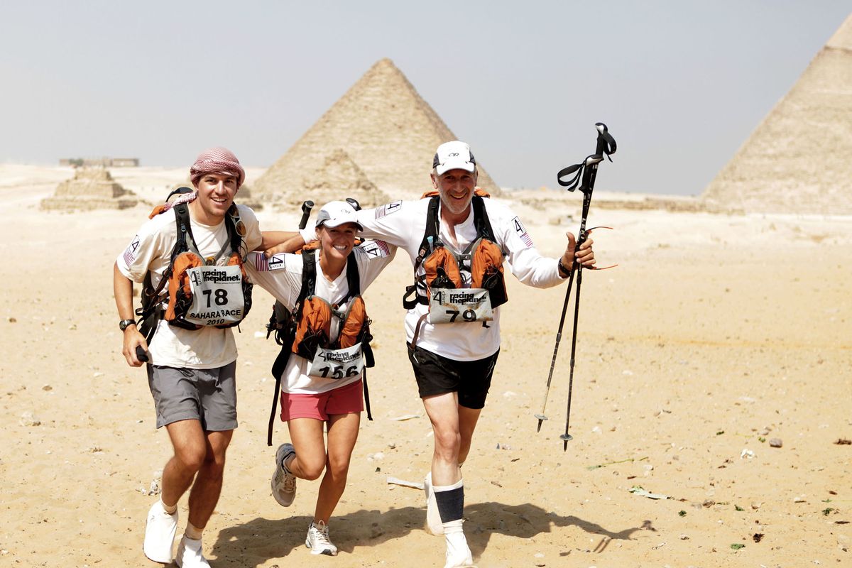 At the Great Pyramids, Ted Lowe, right, celebrates finishing a 158-mile race in the Sahara Desert of Egypt with his son, Matthew, and daughter, Carrie.