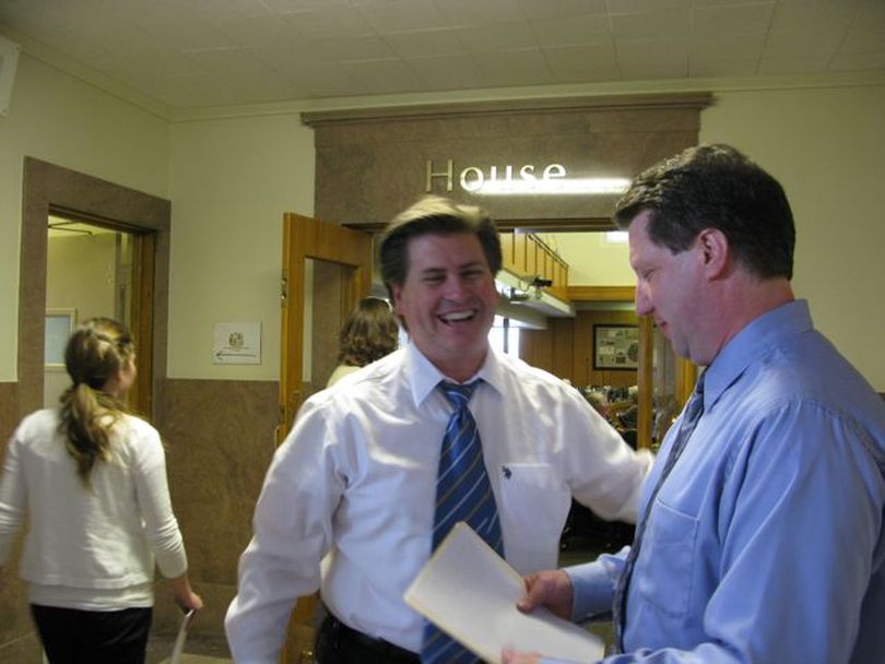 Senate Finance Chairman Dean Cameron, R-Rupert, shares a laugh with JFAC member Rep. Cliff Bayer, R-Boise, on Monday afternoon. The joint budget committee, which delayed meeting last week, is set to meet Tuesday morning. (Betsy Russell / The Spokesman-Review)