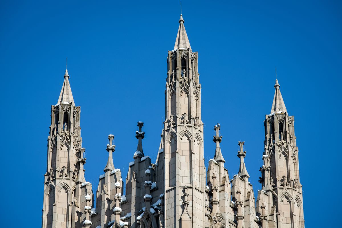 Snow decorates the intricate details of the Cathedral of St. John’s the Evangelist on Sunday, Oct. 25, 2020 in Spokane, Wash. Overnight low temperatures are expected to be in the teens until Tuesday night.  (LIBBY KAMROWSKI)