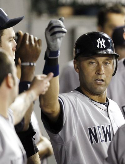 Yankees' Derek Jeter celebrates a home run. (Associated Press)