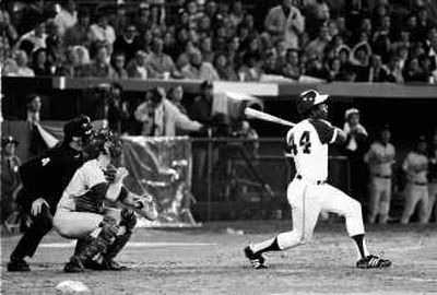 Hank Aaron breaks Babe Ruth's record for career home runs as he hits No. 715 off L.A. Dodgers pitcher Al Downing on April 8, 1974. Associated Press
(FILE Associated Press / The Spokesman-Review)