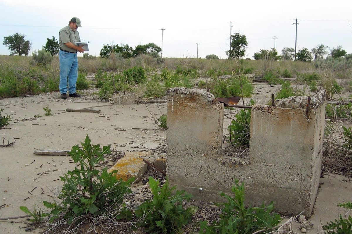 In this June 13, 2006, file photo, Minidoka Internment National Monument superintendent Neil King is shown surveying the remnants of a warehouse at the monument, at Hunt, Idaho. An estimated 13,000 Japanese Americans were detained at the site during World War II. (CHRIS SMITH / AP)