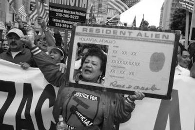 
Demonstrator Yoland Araujo marches in  an immigration protest rally Saturday in Los Angeles. 
 (Associated Press / The Spokesman-Review)