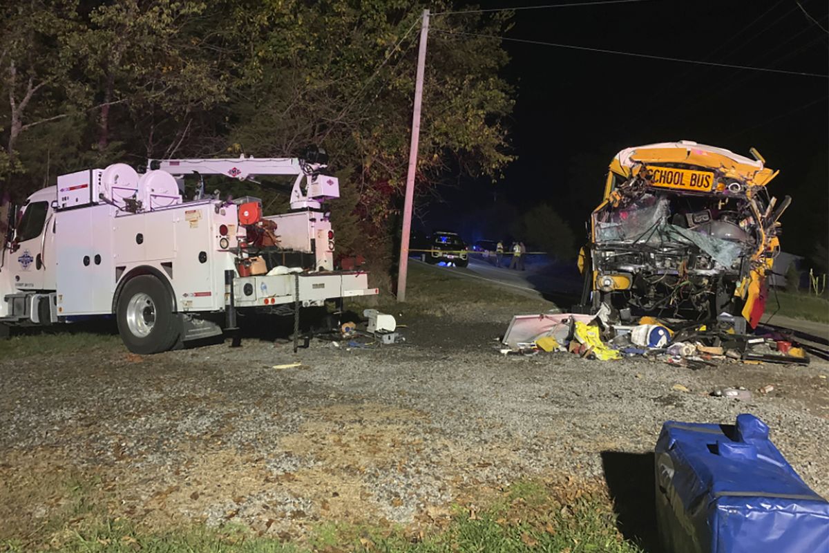 This photo provided by the Tennessee Highway Patrol shows the scene of deadly crash involving a utility vehicle and a school bus carrying children on Tuesday evening, Oct. 27, 2020, in Decatur, Tenn.  (HOGP)