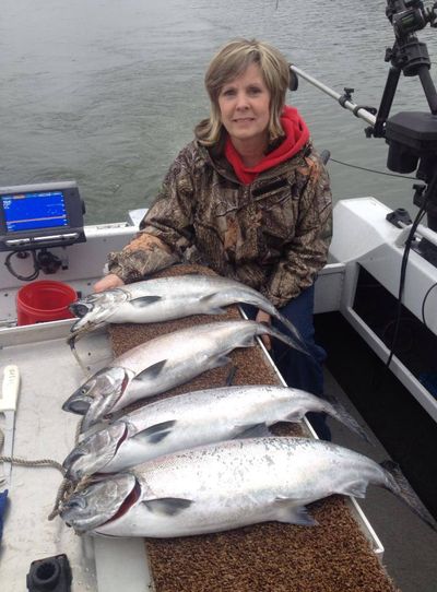 Bev Croston of Kellog displays chinook salmon caught on Lake CdA.