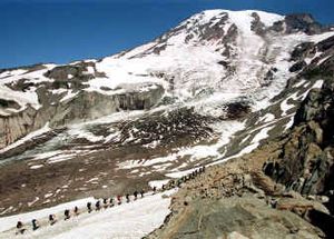 
A line of hikers heads up Mount Rainier. On Tuesday, President Bush signed legislation adding roughly 800 acres to the national park. The expansion gives better access to a popular campground near the Carbon River. 
 (File/Associated Press / The Spokesman-Review)