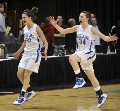 Toutle Lake's Payton Hoff, left, and Shelby Wason leap across the court after beating Lake Roosevelt. (Dan Pelle)