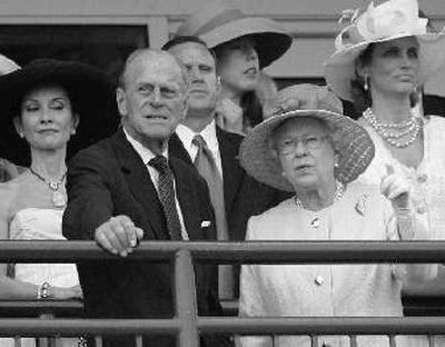 
Queen Elizabeth II and Prince Philip take in the action. 
 (Associated Press / The Spokesman-Review)