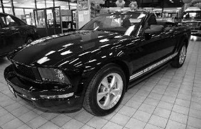 
An unsold 2006 Mustang convertible sits on the floor at a Ford agency in the south Denver suburb of Centennial, Colo.. Ford Motor Co. could post the biggest annual loss in its long history when the automaker reports 2006 earnings today. 
 (Associated Press / The Spokesman-Review)
