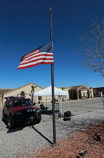 The U.S. flag flies at half-staff outside the Sunset Funeral Home where Antonin Scalia’s body lay Sunday in El Paso, Texas. (Victor Calzada / Associated Press)