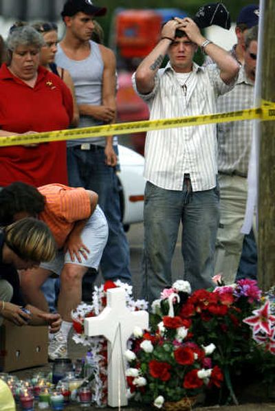 
David Ferguson weeps Sunday at a memorial at the crash site  in Selmer, Tenn. Associated Press
 (Associated Press / The Spokesman-Review)
