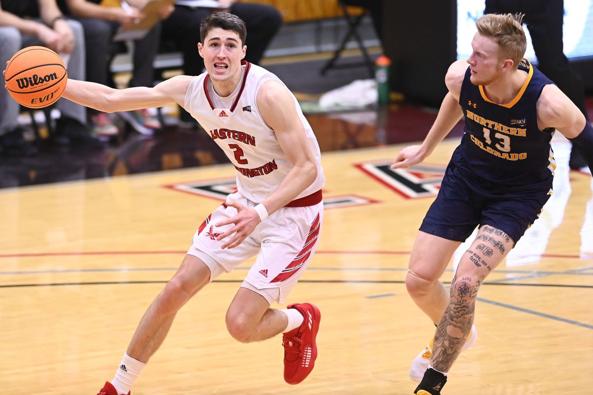 Eastern Washington Eagles guard Steele Venters (2) moves the ball past Northern Colorado Bears guard Bodie Hume (13) during the second half of a college basketball game on Saturday, Jan 22, 2022, at Reese Court in Cheney, Wash. The Northern Colorado Bears won the game 87-83.  (Tyler Tjomsland/The Spokesman-Review)