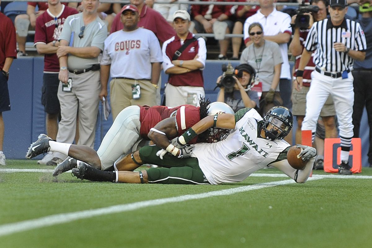 Hawaii receiver Greg Salas reaches over the goal line for a first-quarter touchdown on Saturday in Seattle. (Christopher Anderson / The Spokesman-Review)