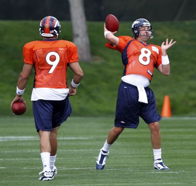 Denver QBs Kyle Orton, right, and Brady Quinn must prepare for Tim Tebow to join the mix.  (Associated Press)