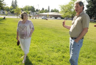 Brenda Corbett and Tony Madunich stand near where the new Hoopfest-sponsored basketball courts will be built this fall in Cannon Park. (Colin Mulvany / The Spokesman-Review)