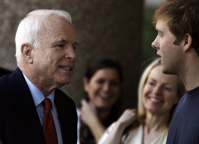 John McCain greets volunteers  at his campaign headquarters in Arlington, Va., on Sunday.  (Associated Press / The Spokesman-Review)