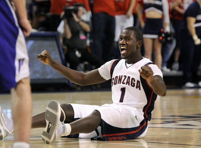 Gonzaga's Mangisto Arop slides across the floor as he celebrates making a shot and being fouled Thursday, Feb. 4, 2010, in the first half against Portland at the McCarthy Athletic Center. (Dan Pelle / The Spokesman-Review)