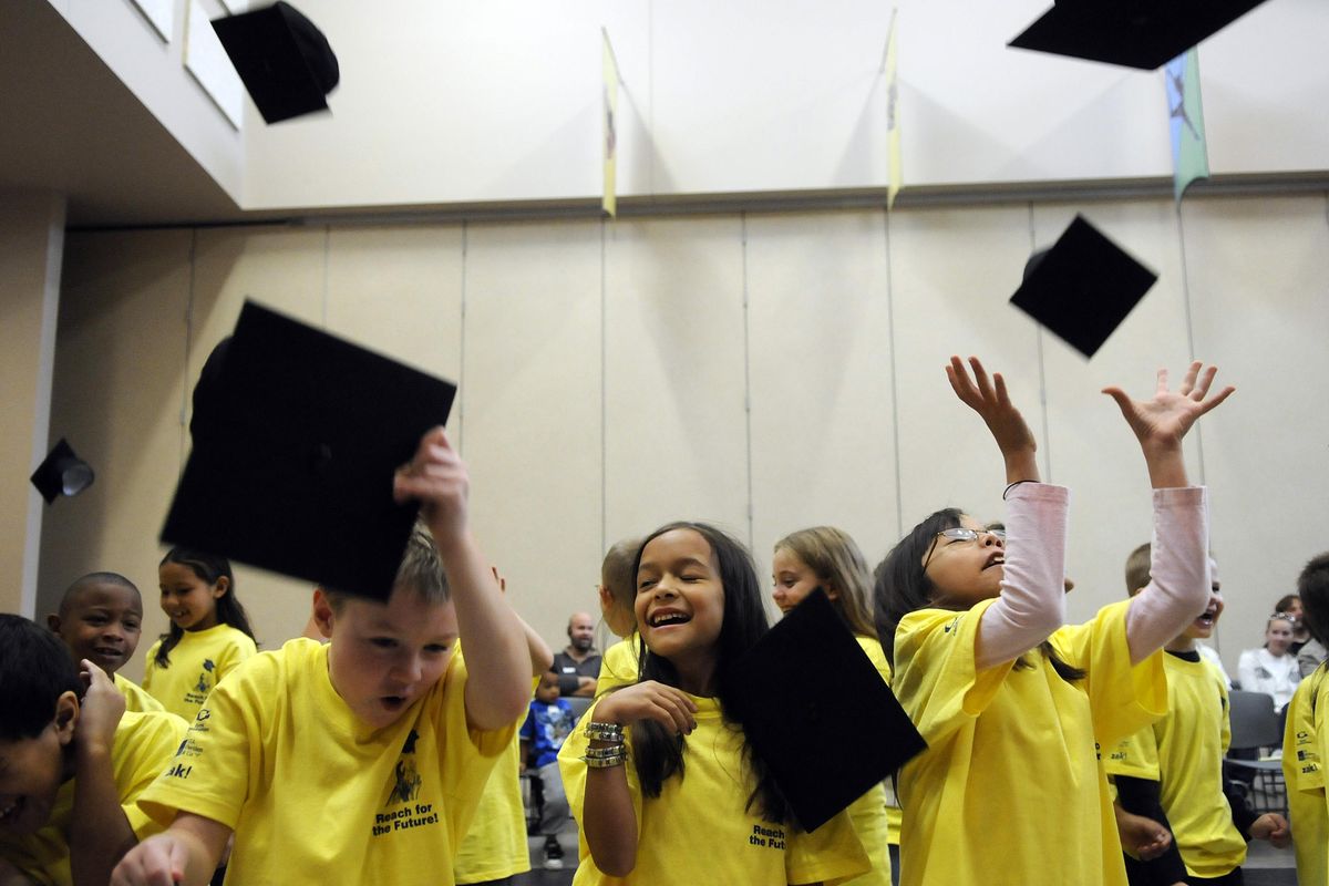 Lidgerwood Elementary School second-graders Jordan Meredith, Allison Christianson and Alyson Coulter toss their mortar boards into the air at the conclusion of an announcement, Sept. 25, 2008, that Spokane-based Reach for the Future will offer 49 students full college educations. The  program included after-school tutoring and mentoring through high school. Now graduating from high school and headed to college are EWU Running Start senior Jordan Meredith, hoping to study computer science; Rogers senior Allison Christianson, psychology; and Newtech Skills Center’s Alyson Coulter, psychology. (Dan Pelle / The Spokesman-Review)
