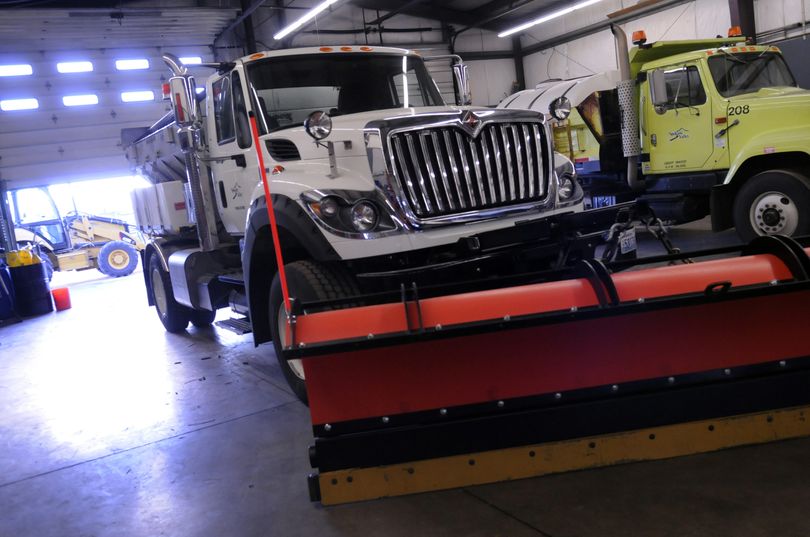 The city of Spokane Valley’s new snowplow is parked next to one of the original plows at the Public Works Facility in the Industrial Park. The old snowplows, purchased from the WSDOT, averaged 2,500 miles each during last year’s snowy winter. (J. Bart Rayniak)