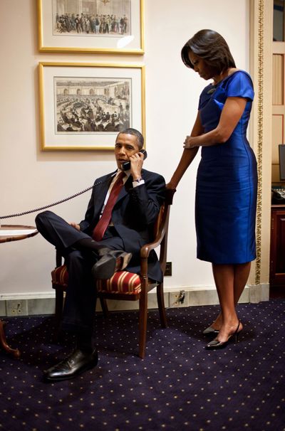 This photo provided by the White House shows President Barack Obama during a phone call immediately after his State of the Union address, informing John Buchanan that his daughter Jessica was rescued. (Associated Press)