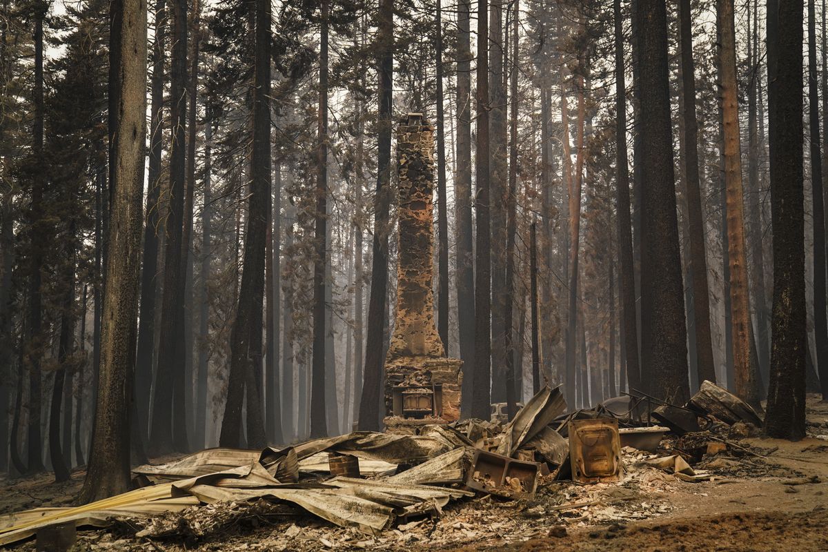 A chimney stands on a property destroyed by the Caldor Fire near South Lake Tahoe, Calif., Tuesday, Aug. 31, 2021.  (Jae C. Hong)