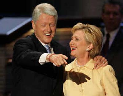 
Former President Clinton stands with his wife, Sen. Hillary Rodham Clinton, after she introduced him at the Democratic National Convention at the FleetCenter in Boston on Monday.
 (Gary Hershorn/Reuters / The Spokesman-Review)