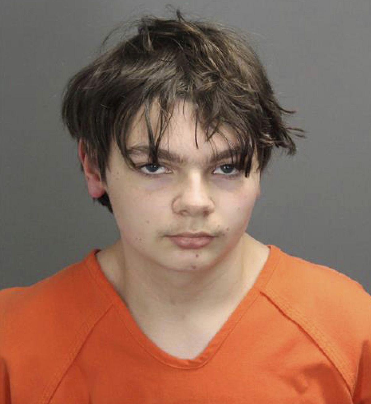 This booking photo released by the Oakland County, Mich., Sheriff's Office shows Ethan Crumbley, 15, who is charged as an adult with murder and terrorism for a shooting that killed four fellow students and injured more at Oxford High School in Oxford, Mich., authorities said Dec. 1, 2021.  (HOGP)
