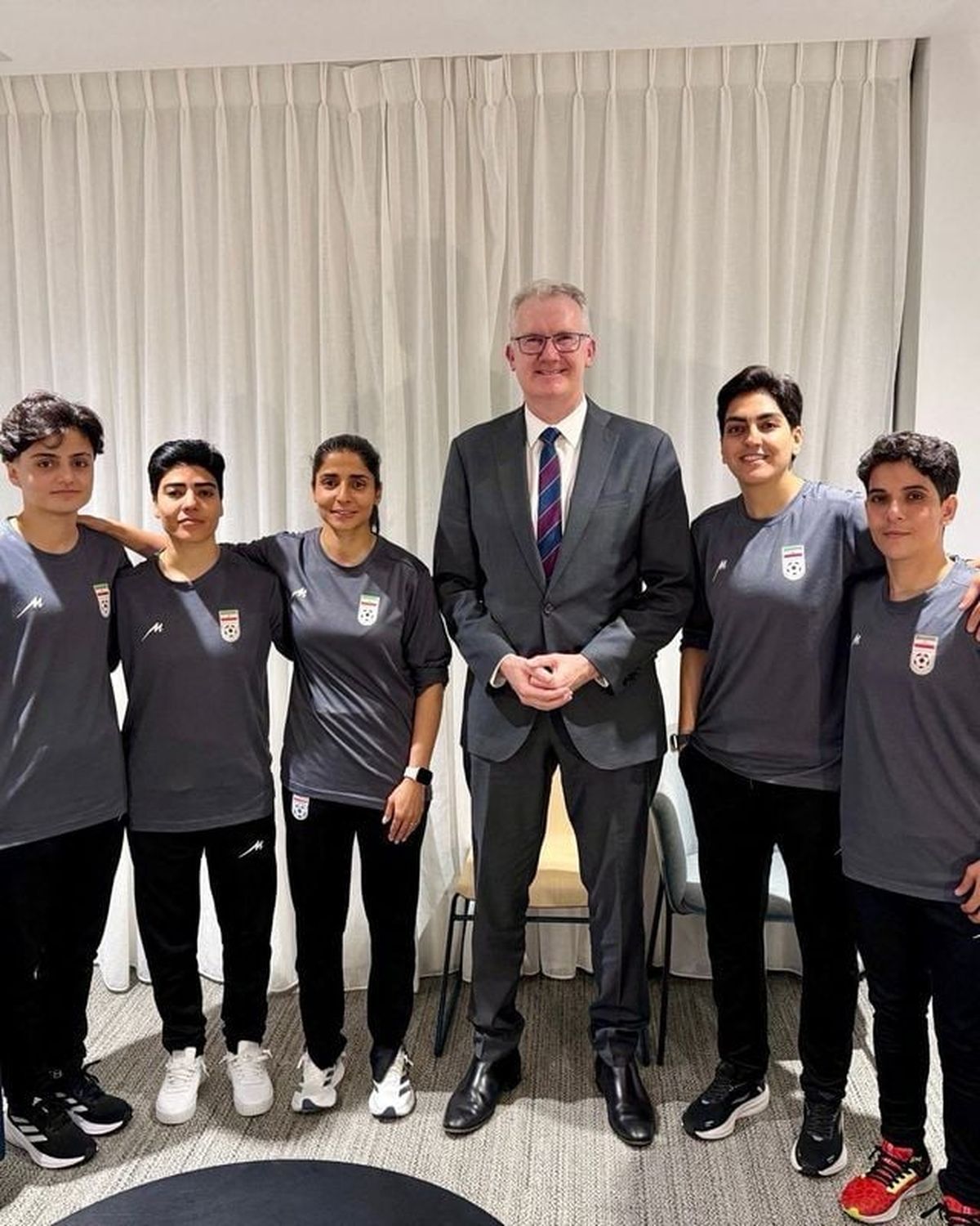 Australia’s Home Affairs Minister Tony Burke poses with Fatemeh Pasandideh, Mona Hamoudi, Atefeh Ramezanizadeh, Zahra Ghanbari and Zahra Sarbali, the five women from the Iranian women’s soccer team who were granted humanitarian visas, in Queensland, Australia, March 9, 2026. @Tony_Burke on X/Handout via REUTERS THIS IMAGE HAS BEEN SUPPLIED BY A THIRD PARTY  (HANDOUT)