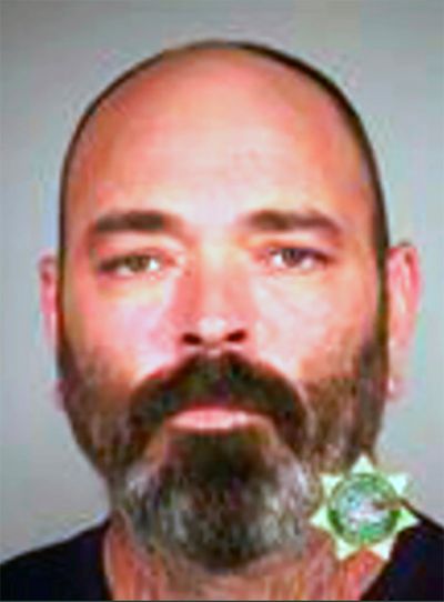 FILE - This undated booking file photo provided by the Multnomah County Sheriff's Office shows Alan James Swinney, a member of the Proud Boys right-wing group. Swinney has been sentenced to 10 years in prison for his violent actions during August 2020 protests in Portland, Oregon. (HOGP)