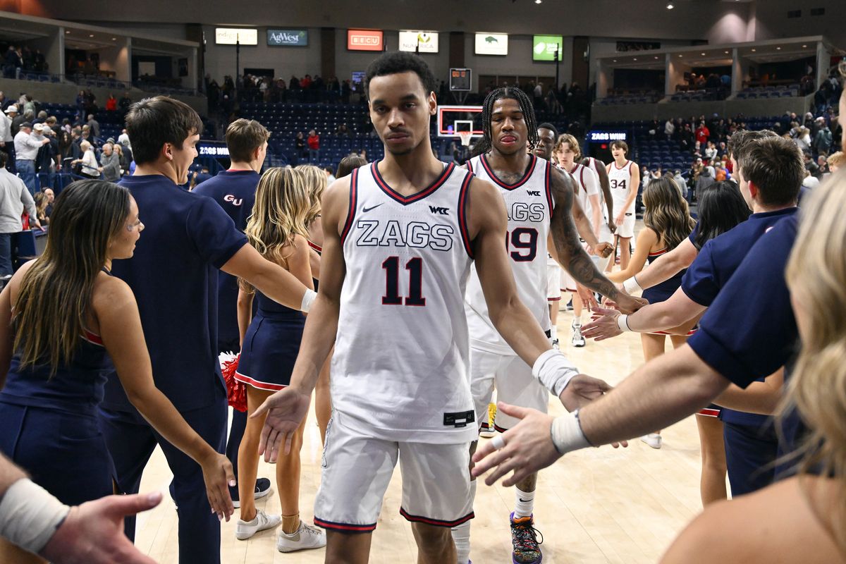 Gonzaga Bulldogs guard Nolan Hickman (11) and Gonzaga Bulldogs guard Khalif Battle (99) and the rest of the Zags leave the court after defeating San Diego 93-80 during a NCAA college basketball game, Wed., Jan. 8, 2025, in the McCarthey Athletic Center.  (COLIN MULVANY)