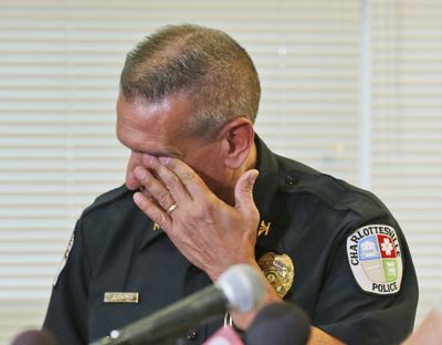 Charlottesville police Chief Tim Longo wipes his eyes during a media briefing Saturday in Charlottesville, Va. (Associated Press)
