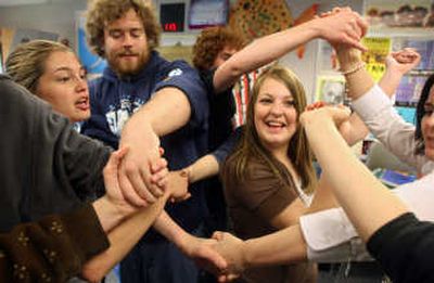 
Darrington High School freshman Amber Jessen, 15, right, tries to untangle herself from other students, including seniors, during a teamwork exercise last week. Seniors were inspired to help freshmen after hearing the Dalai Lama speak. Associated Press
 (Associated Press / The Spokesman-Review)