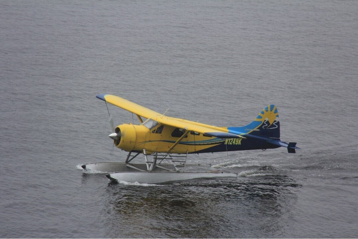 This Thursday, Aug. 5, 2021, photo provided by Lee LaFollette shows a de Havilland Beaver aircraft departing the Port of Ketchikan, Alaska. Foggy, reduced-visibility conditions have delayed efforts to recover the wreckage of a sightseeing plane that crashed in southeast Alaska, killing six people. Clint Johnson, chief of the National Transportation Safety Board’s Alaska region, says the agency had hoped to recover the wreckage Sunday. But he says those efforts were called off due to poor conditions. He says the crew planned to try again on Monday, Aug. 9, 2021.  (Lee LaFollette)