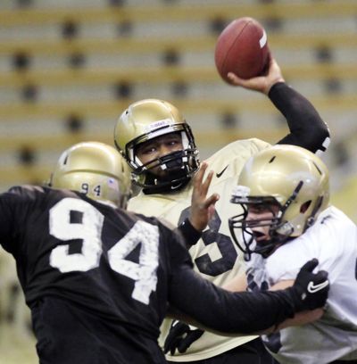 Idaho quarterback Dominique Blackman, center, attempts a pass during the Silver and Gold  scrimmage. (Dean Hare / The Moscow-pullman Daily News)