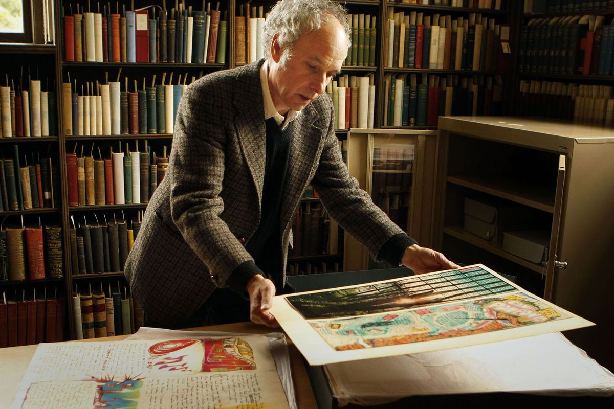 James Fox, head of the University of Oregon Special Collections Library, looks over a portion of the Ken Kesey papers on Monday. (Associated Press)