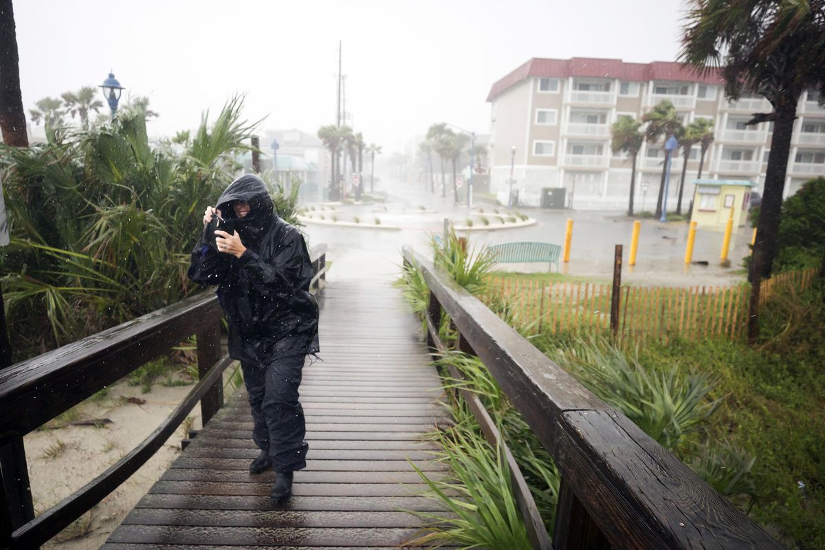 Bethany Kellam walks onto the southend beach of Tybee Island, Ga., Monday, Sept., 11, 2017. The National Weather Service placed most of Georgia under a tropical storm warning. (Stephen B. Morton / AP)