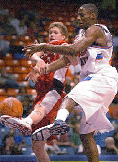 
Eastern's Eric Henkel (3) loses the ball while getting tangled up under the basket. 
 (Associated Press / The Spokesman-Review)