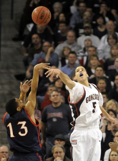 Austin Daye’s shot-blocking ability, here sending one back against Patty Mills of Saint Mary’s, is one of his biggest assets on defense.  (Jesse Tinsley / The Spokesman-Review)