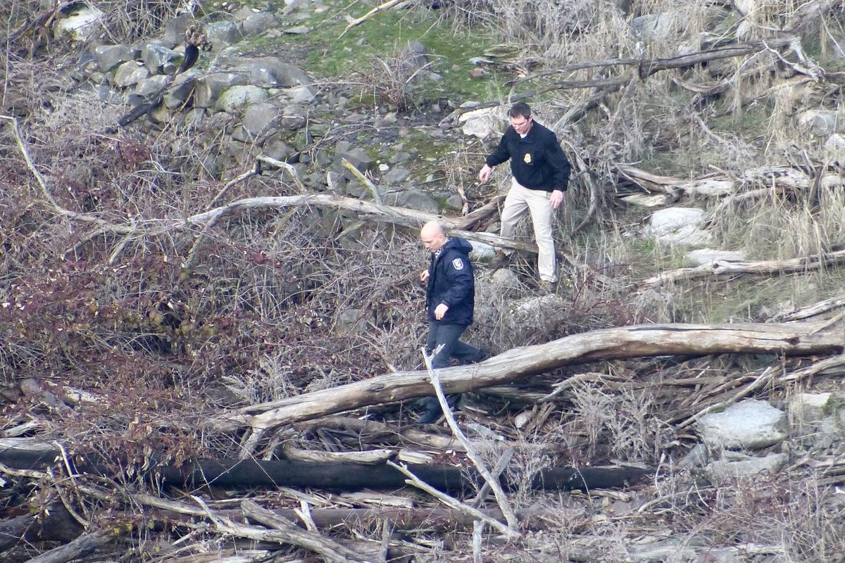 Police and emergency personnel find a body on the north bank of the Spokane River on Tuesday morning, Jan. 26, 2016. (Jesse Tinsley / The Spokesman-Review)