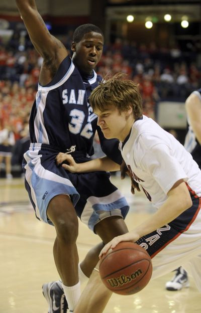 Gonzaga's Grant Gibbs is fouled by San Diego's Ken Rancifer  (32) in the first half of play in McCarthey Athletic Center Sat. Feb. 13, 2010. (Colin Mulvany / The Spokesman-Review)
