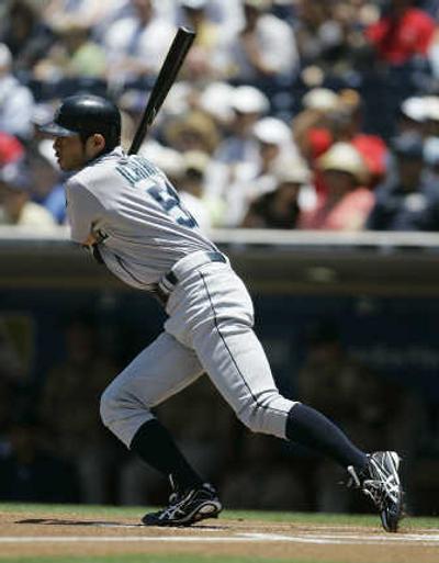 
Mariners' Ichiro Suzuki strokes the first of his five singles Sunday. Associated Press
 (Associated Press / The Spokesman-Review)