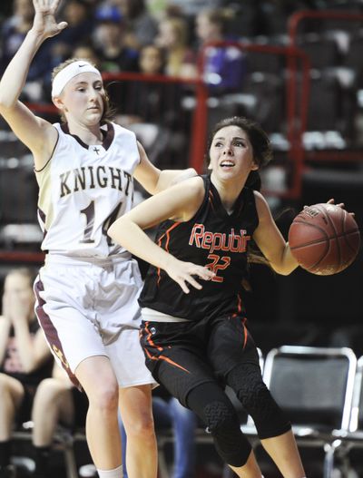 Republic's Shania Graham (32) drives the ball against Sunnyside Christian's Alyssa Martin (14) during the 2017 1B Girls Hardwood Classic Washington State Tournament on Friday, March 3, 2017, at Spokane Arena in Spokane, Wash. (Tyler Tjomsland / The Spokesman-Review)