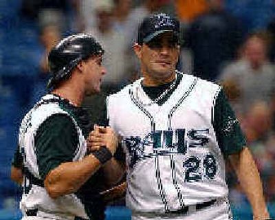 
Tampa Bay catcher Brook Fordyce, left, congratulates Danny Baez on a job well done. 
 (Associated Press / The Spokesman-Review)