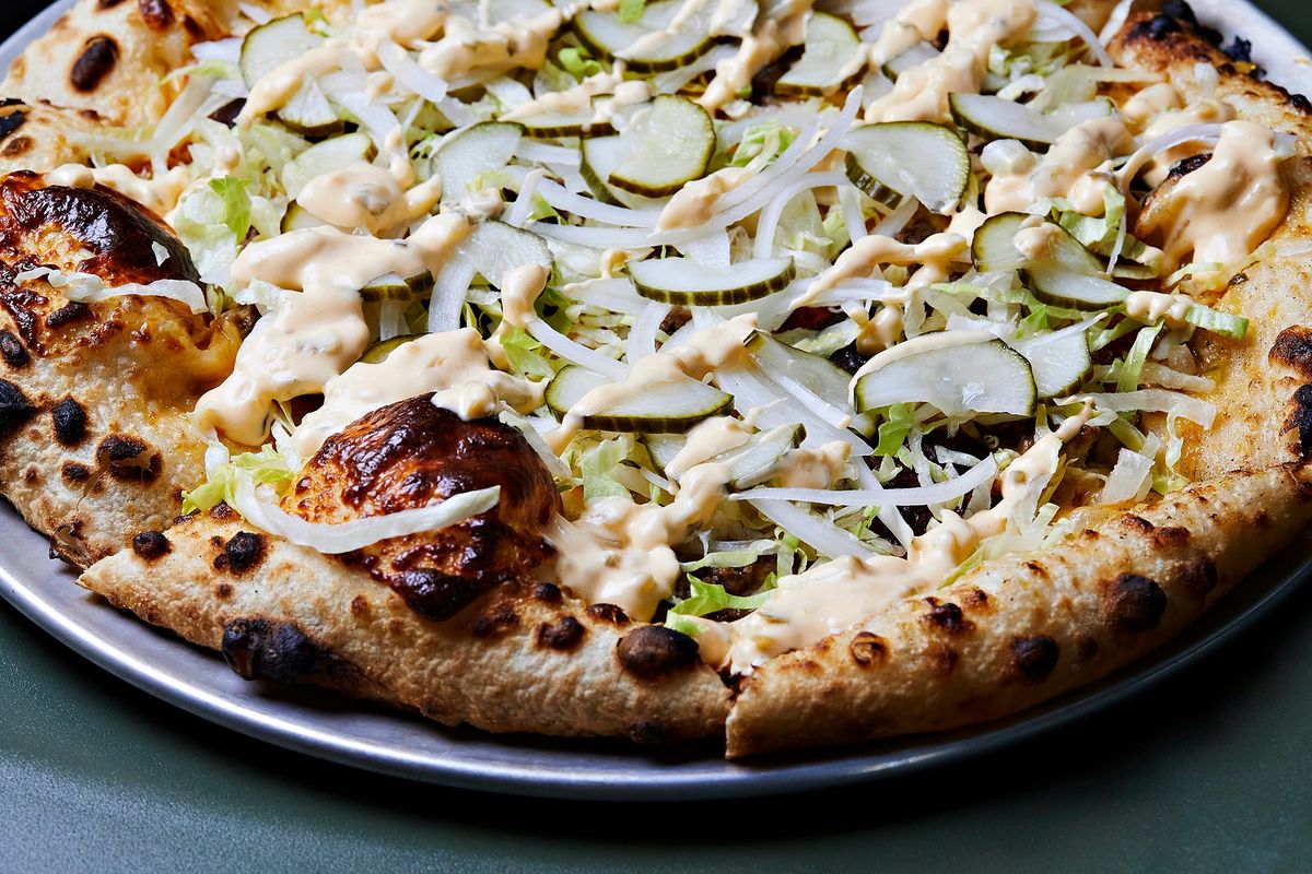 The Harambe Loved Big Macs pizza, with special sauce, beef, American cheese, iceberg lettuce, onions and pickles at Boogy Peel restaurant in Washington, D.C. MUST CREDIT: Photo for The Washington Post by Deb Lindsey. (Deb Lindsey/For The Washington Post)