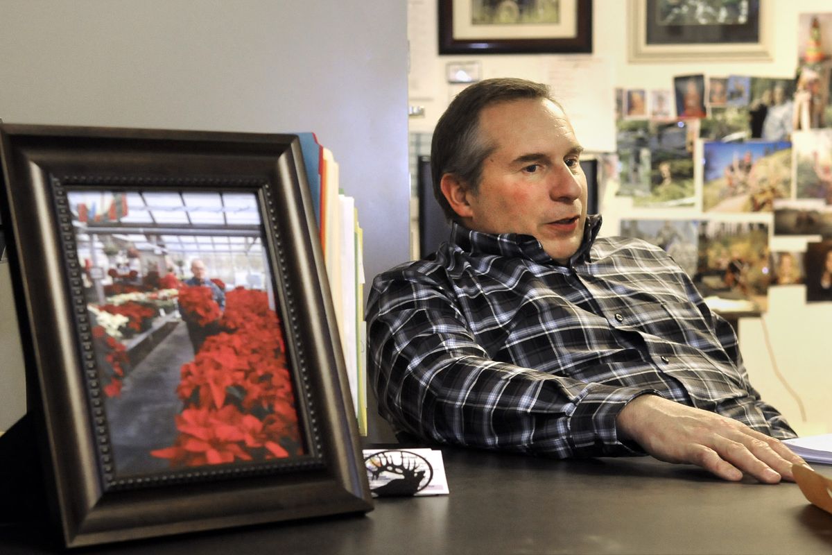 Alan Creach says his family is “trying to find the truth” in the shooting death of his father, Wayne Scott Creach, pictured on desk.  (Dan Pelle)
