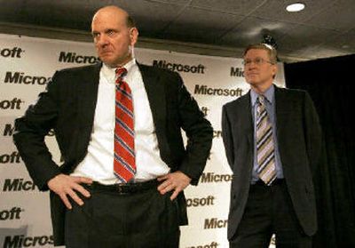 
Microsoft CEO Steve Ballmer, left, and Jeff Raikes, Microsoft president of business, listen during a press conference after the company's 