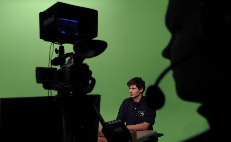 Central Valley High senior Chris Pittella, center, works the anchor position during the taping of CV’s weekly sports show on Monday. The show airs Thursdays at 10:35 p.m. on KAYU. (Kathy Plonka)