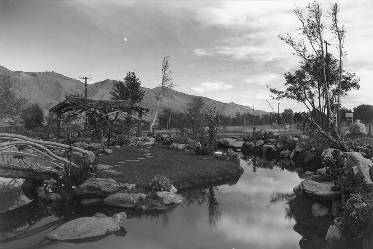 Ansel Adams’ images from 1943 include at left, “Loading Bus,” and “Pleasure Garden of the Moon,” above.
