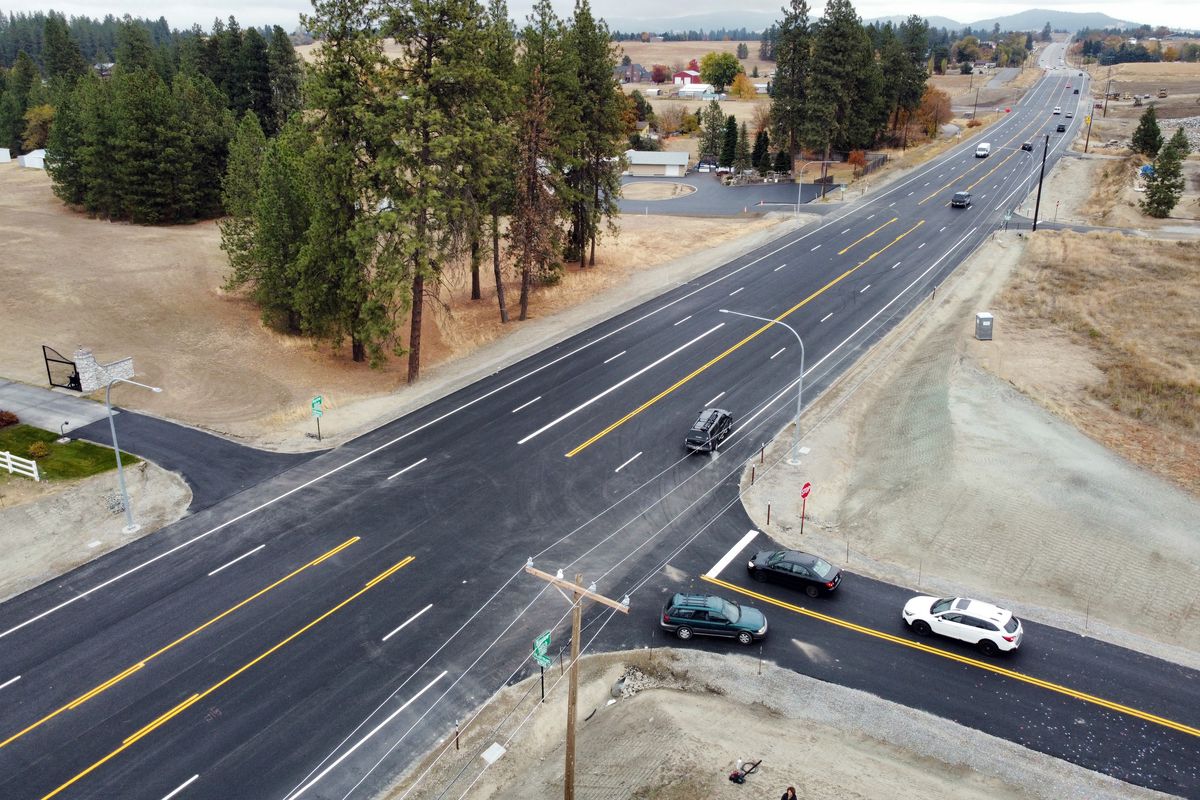 Looking east from the intersection with Thierman Road, the recently renovated Bigelow Gulch Road is shown Tuesday in its much-improved state which features two lanes in each direction, a turn lane and shoulders.  (Jesse Tinsley/THE SPOKESMAN-REVIEW)